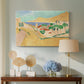 Canvas art print featuring an expressive depiction of coastal town under bright light, displayed above a styled console table