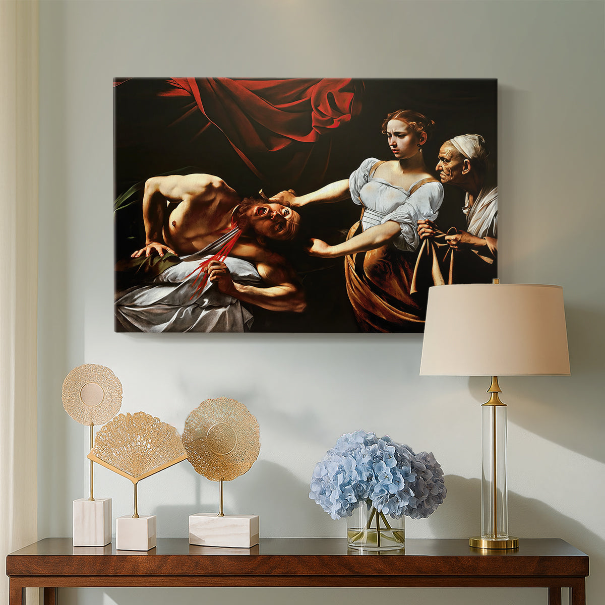 Canvas art print featuring an intense moment of Judith slaying Holofernes with sword, displayed above a styled console table