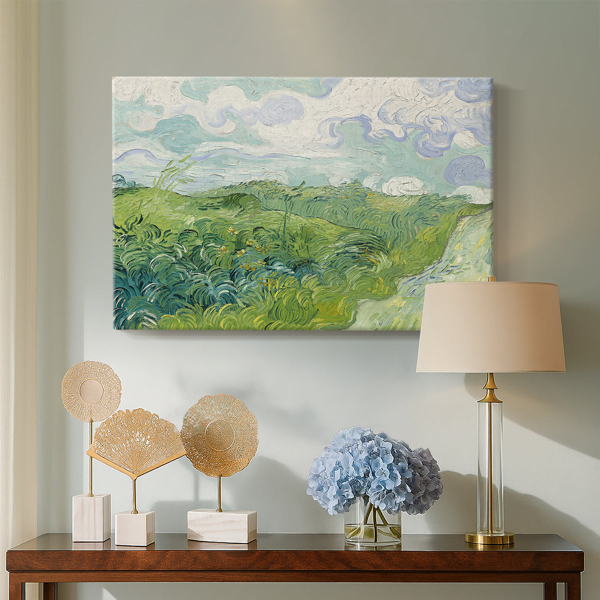 Canvas art print featuring an expressive landscape dominated by green crops and open sky, displayed above a styled console table