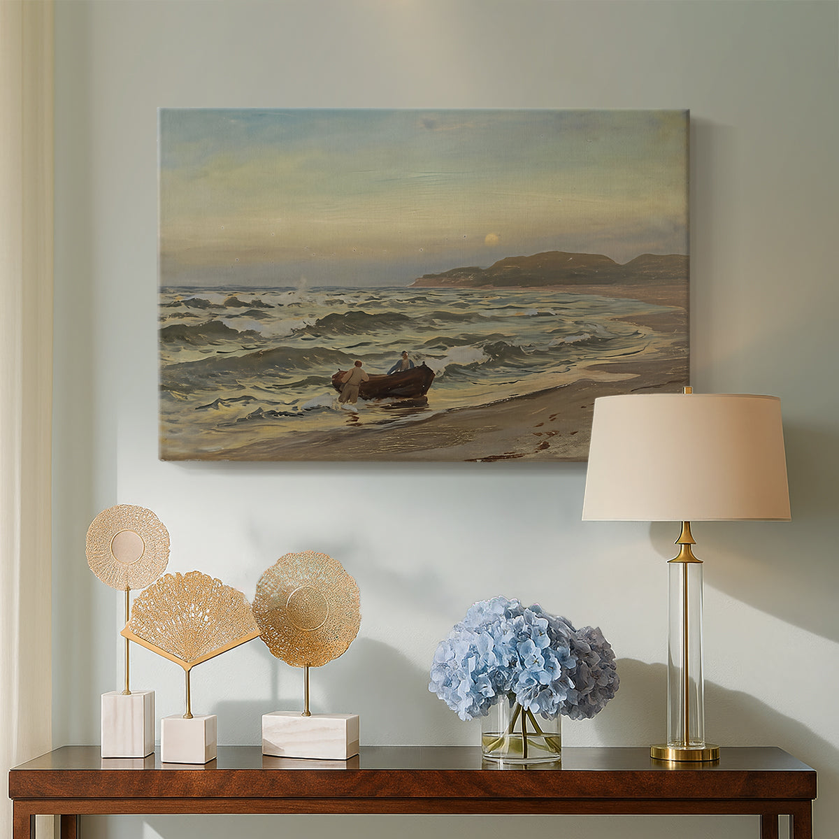 Canvas art print featuring a moody maritime landscape with storm clouds over ocean, displayed above a styled console table