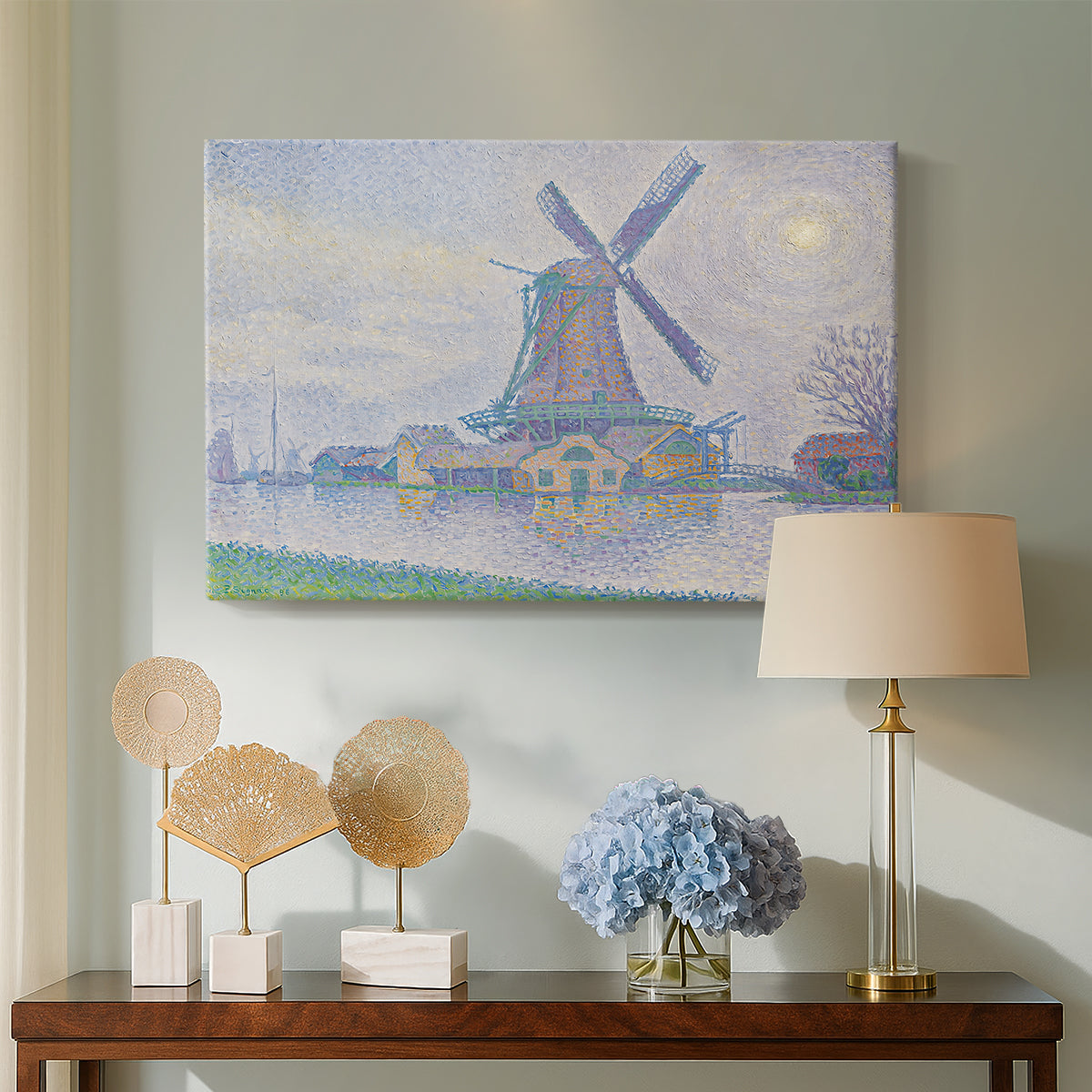 Canvas art print featuring a countryside view with windmill, displayed above a styled console table
