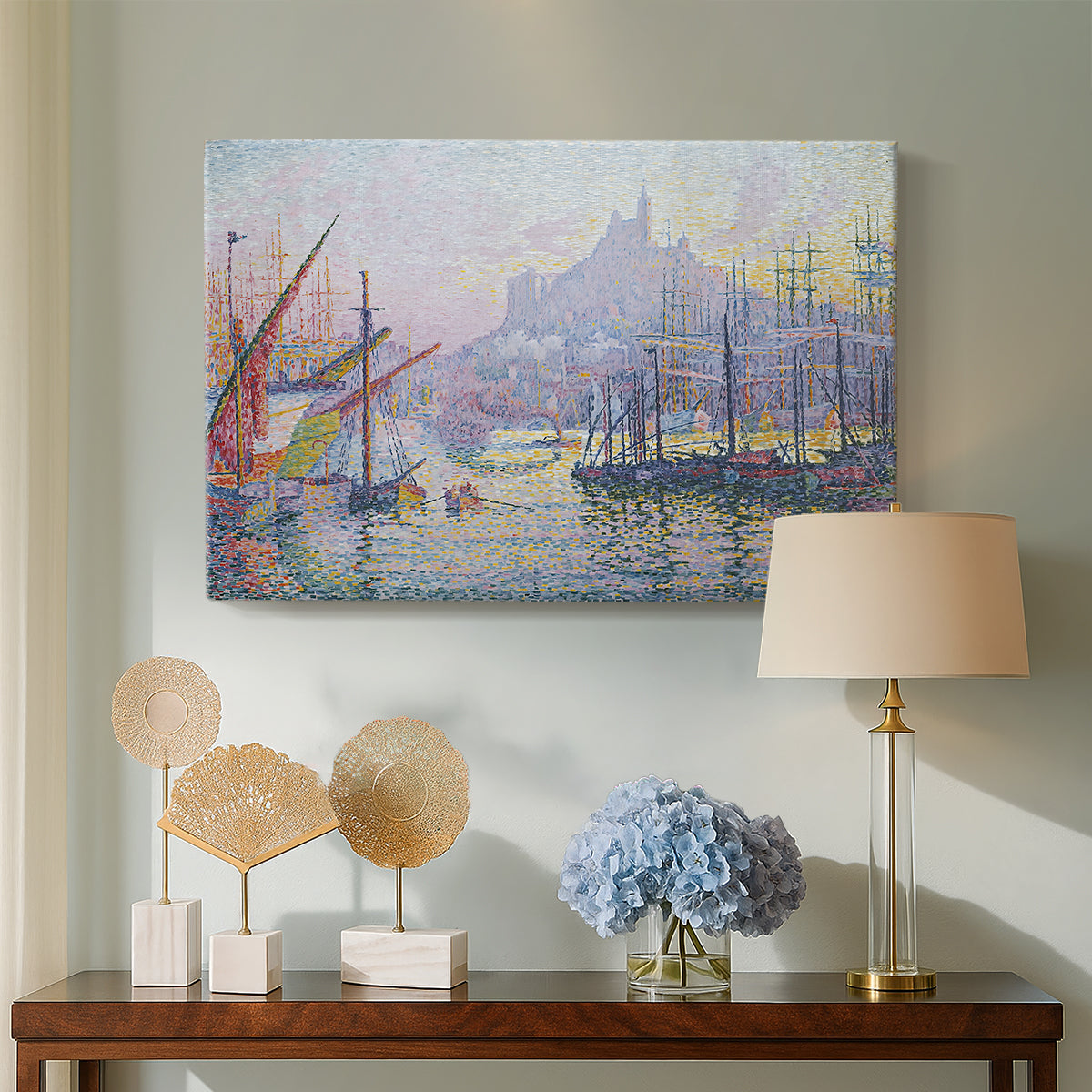 Canvas art print featuring a pointillist port activity, displayed above a styled console table