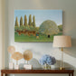 Canvas art print featuring a naïve landscape with animals and rolling greenery, displayed above a styled console table