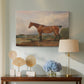 Canvas art print featuring a realistic depiction of hunter in natural terrain, displayed above a styled console table