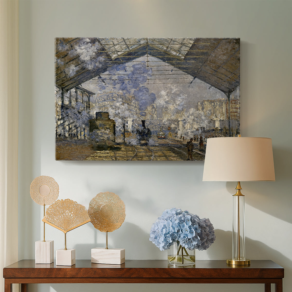 Canvas art print featuring an industrial interior with steam clouds and rail tracks, displayed above a styled console table