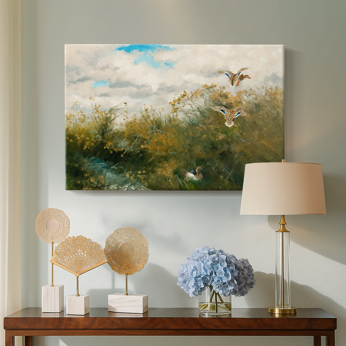 Canvas art print featuring a group of ducks foraging in natural marsh setting, displayed above a styled console table
