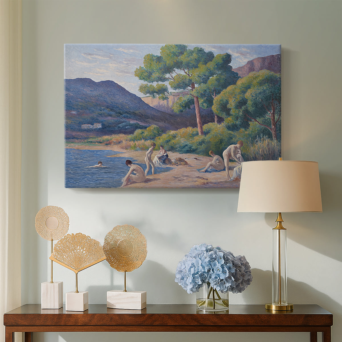 Canvas art print featuring a coastal composition with figures and color texture, displayed above a styled console table