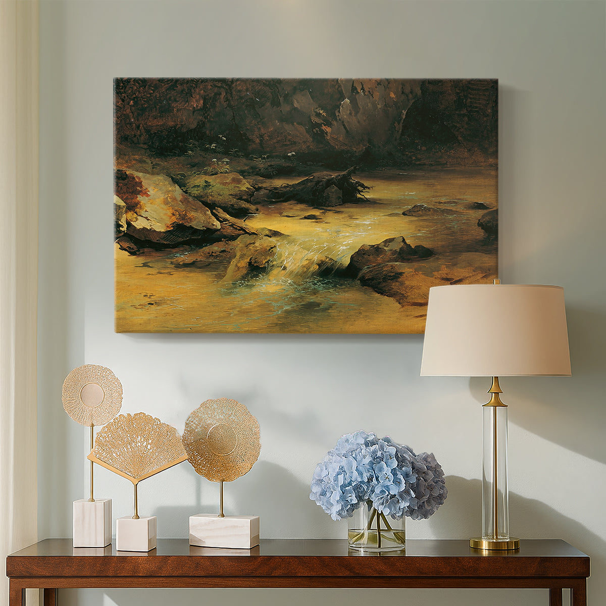 Canvas art print featuring a natural landscape with moving water, displayed above a styled console table
