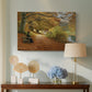Canvas art print featuring a countryside path lined with trees and warm seasonal colors, displayed above a styled console table
