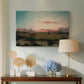 Canvas art print featuring a luminist scene with reflective water, displayed above a styled console table