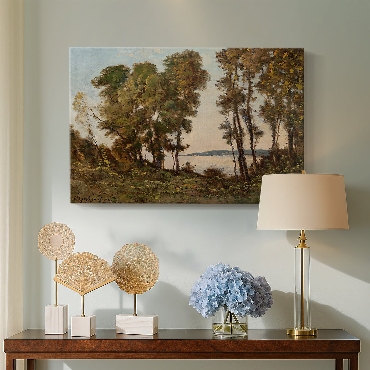 Canvas art print featuring a natural landscape with water and dense greenery, displayed above a styled console table
