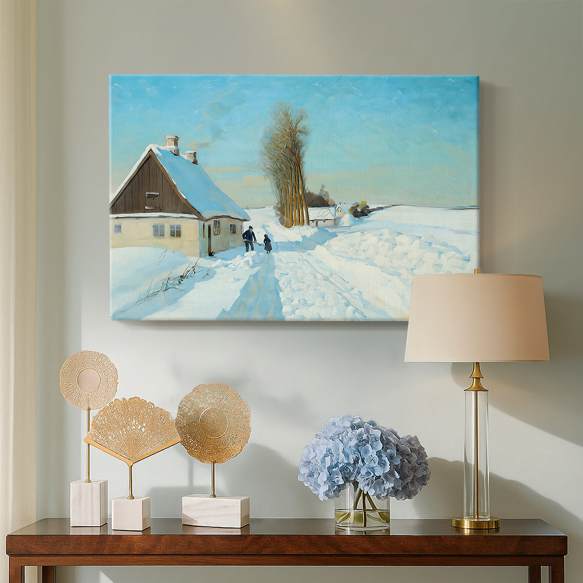 Canvas art print featuring a winter day with fresh snow and figure working outdoors, displayed above a styled console table