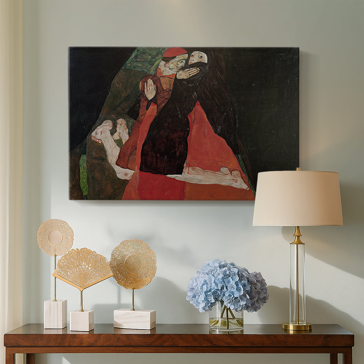 Canvas art print featuring an expressive painting of figures entwined with bold lines and color, displayed above a styled console table