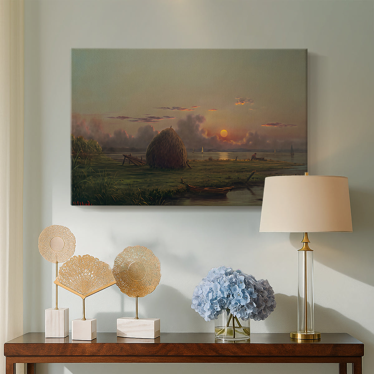 Canvas art print featuring a rural scene with haystack, displayed above a styled console table