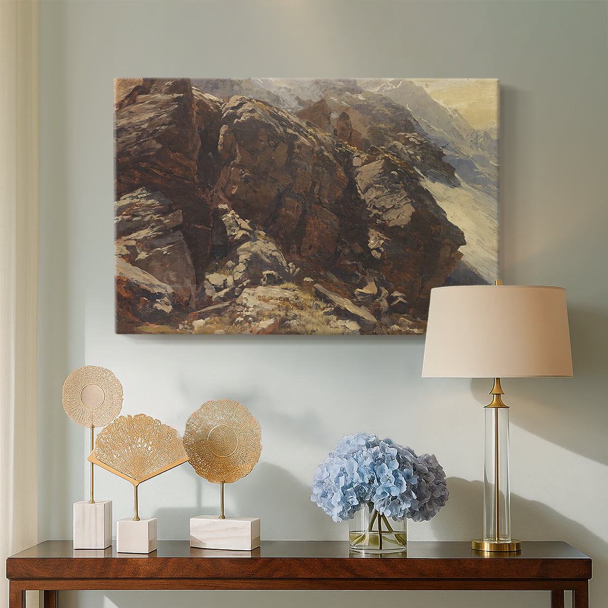 Canvas art print featuring a high-altitude scene with rocky formations and sparse vegetation, displayed above a styled console table