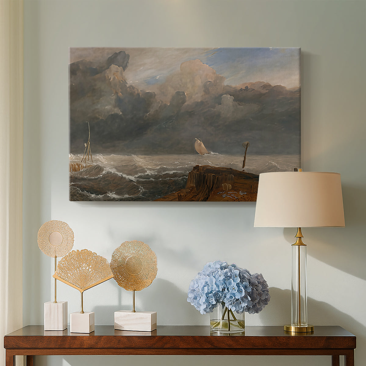 Canvas art print featuring an atmospheric coastal view, displayed above a styled console table