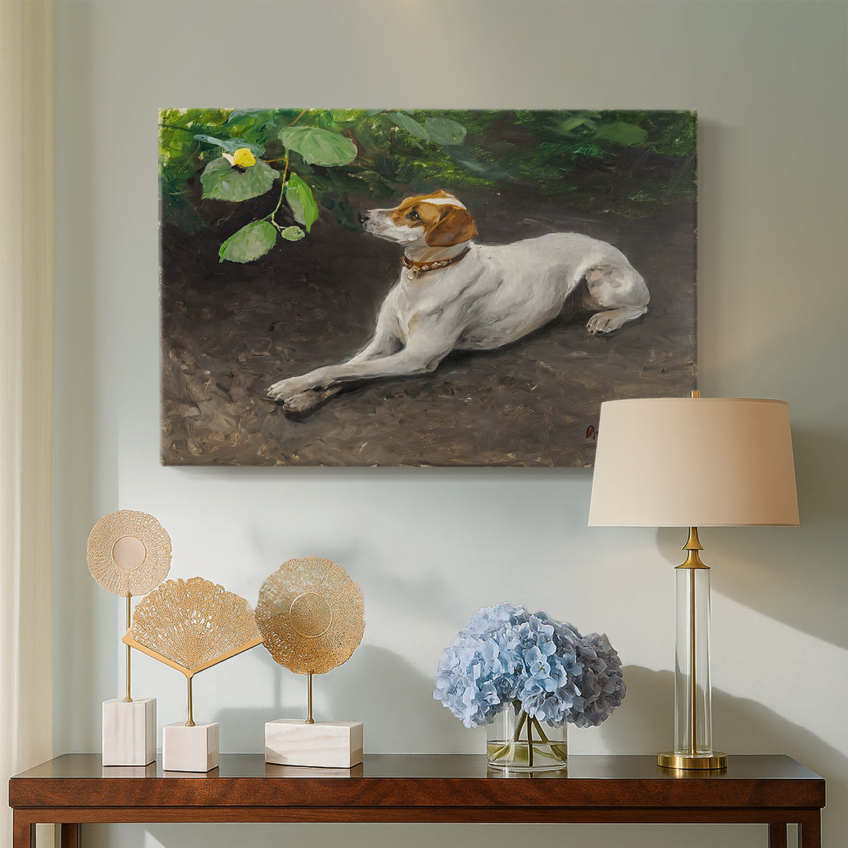 Canvas art print featuring an animal painting of dog stretched out on earthy terrain, displayed above a styled console table