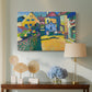 Canvas art print featuring a simplified town scene with bold blocks of color and defined outlines, displayed above a styled console table