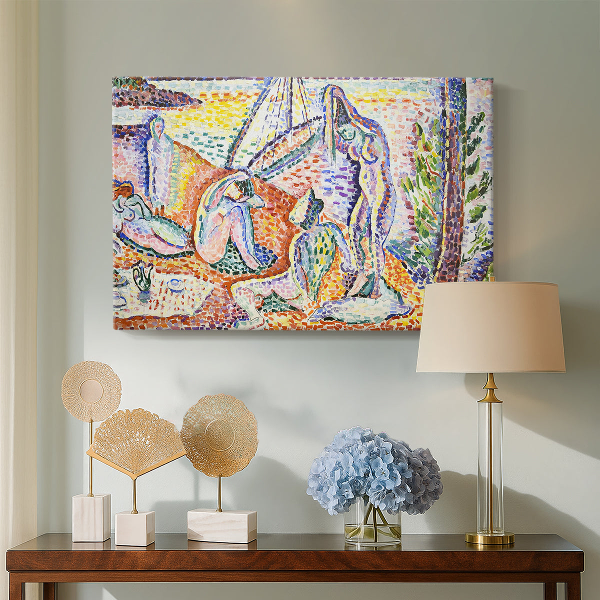 Canvas art print featuring a pointillist-inspired leisure scene in a colorful natural setting, displayed above a styled console table