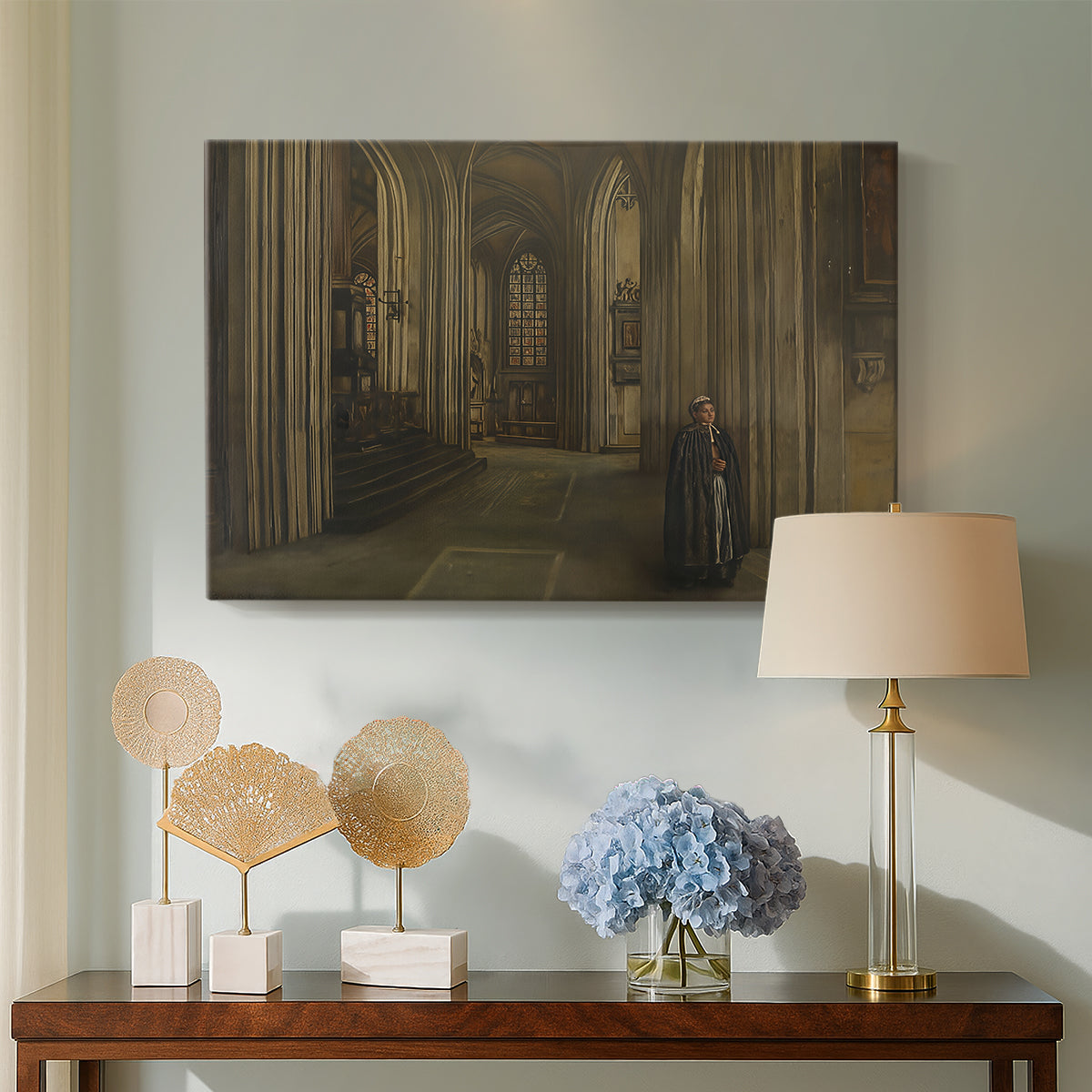 Canvas art print featuring a dimly lit religious building with structural details, displayed above a styled console table