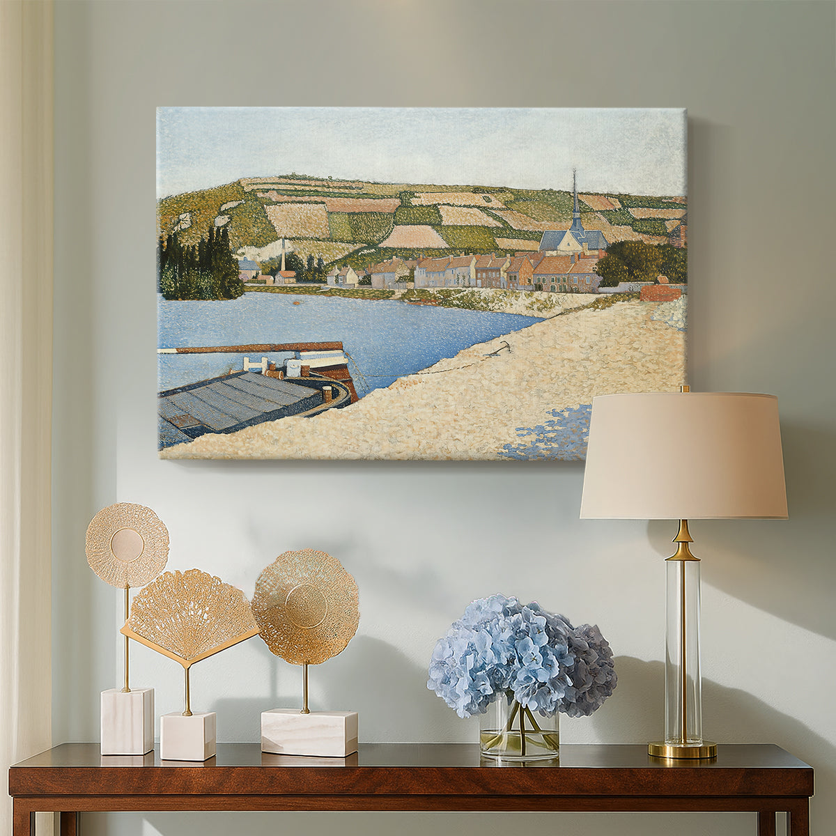 Canvas art print featuring a landscape with shoreline and architecture, displayed above a styled console table
