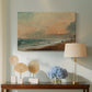 Canvas art print featuring an atmospheric coastal view with horizon, displayed above a styled console table
