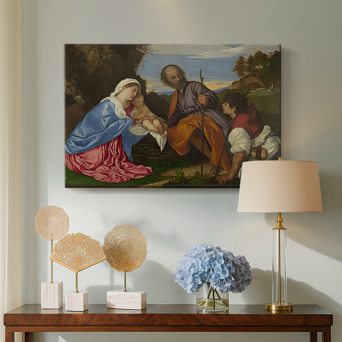 Canvas art print featuring a devotional composition combining sacred family and shepherd figure, displayed above a styled console table