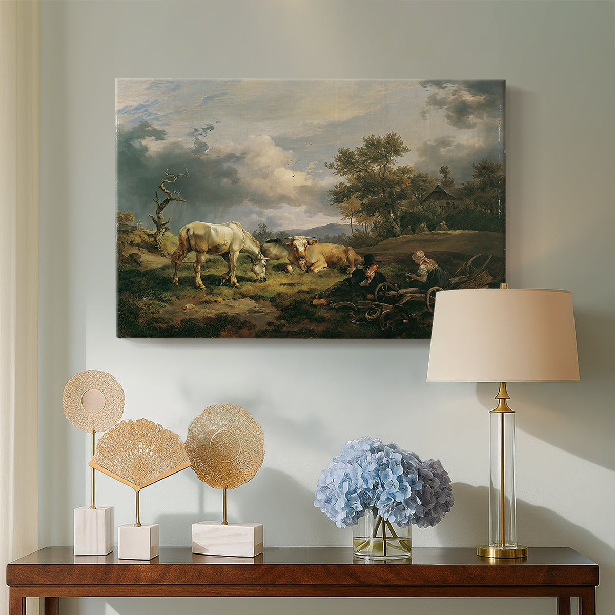 Canvas art print featuring a rural composition with human presence, displayed above a styled console table