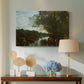 Canvas art print featuring an atmospheric landscape with lake and layered terrain, displayed above a styled console table
