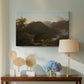Canvas art print featuring a scenic sunrise view with deep valley and layered peaks, displayed above a styled console table