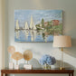 Canvas art print featuring an impressionist depiction of sailing competition on water, displayed above a styled console table
