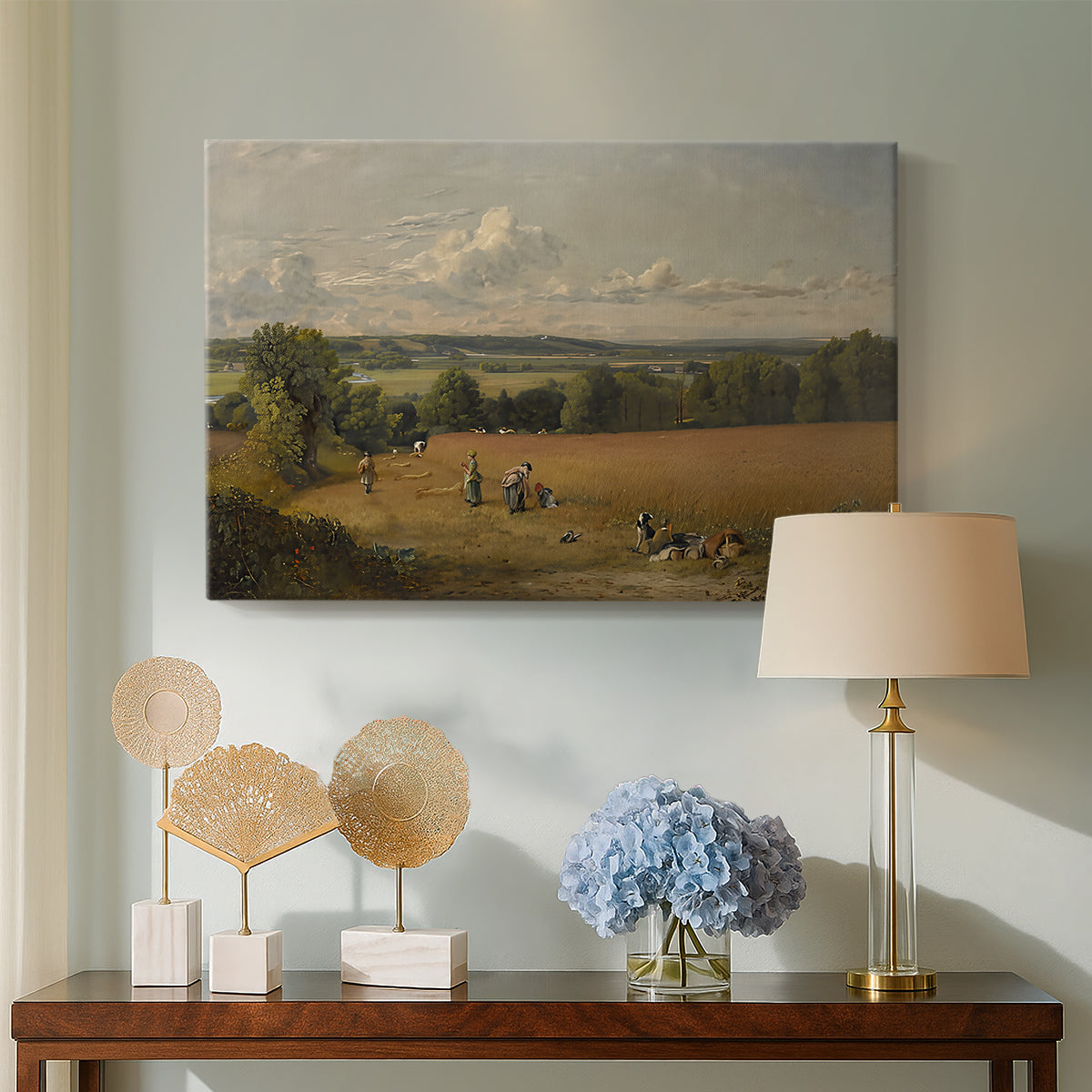 Canvas art print featuring a countryside scene with agriculture, displayed above a styled console table