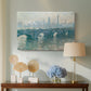 Canvas art print featuring a soft-toned river scene with bridge and muted skyline, displayed above a styled console table