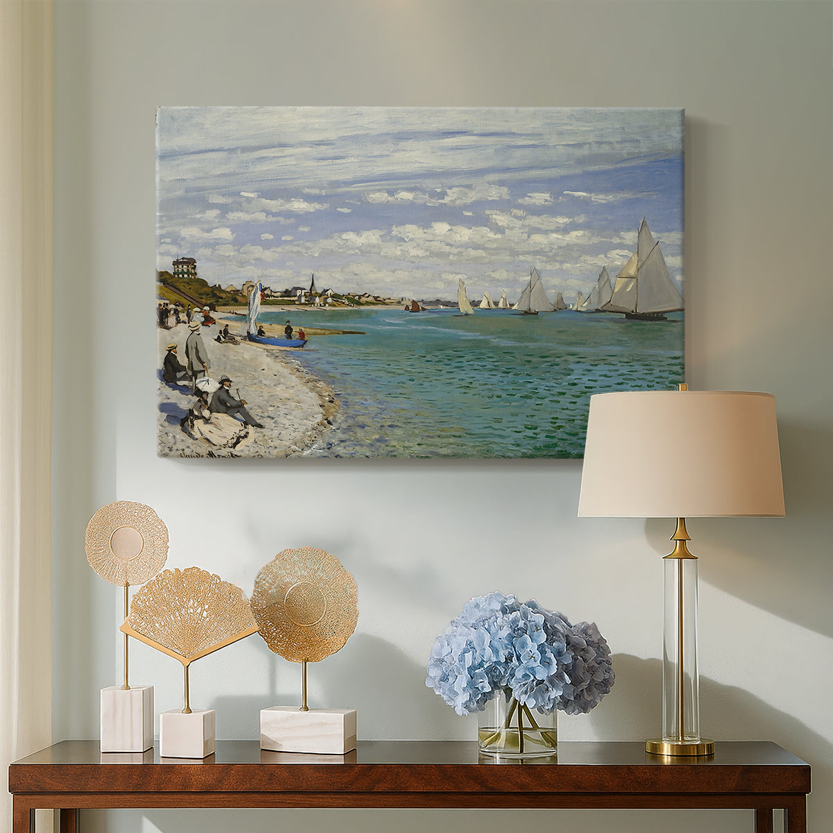 Canvas art print featuring an impressionist coastal view with colorful sails and shoreline activity, displayed above a styled console table