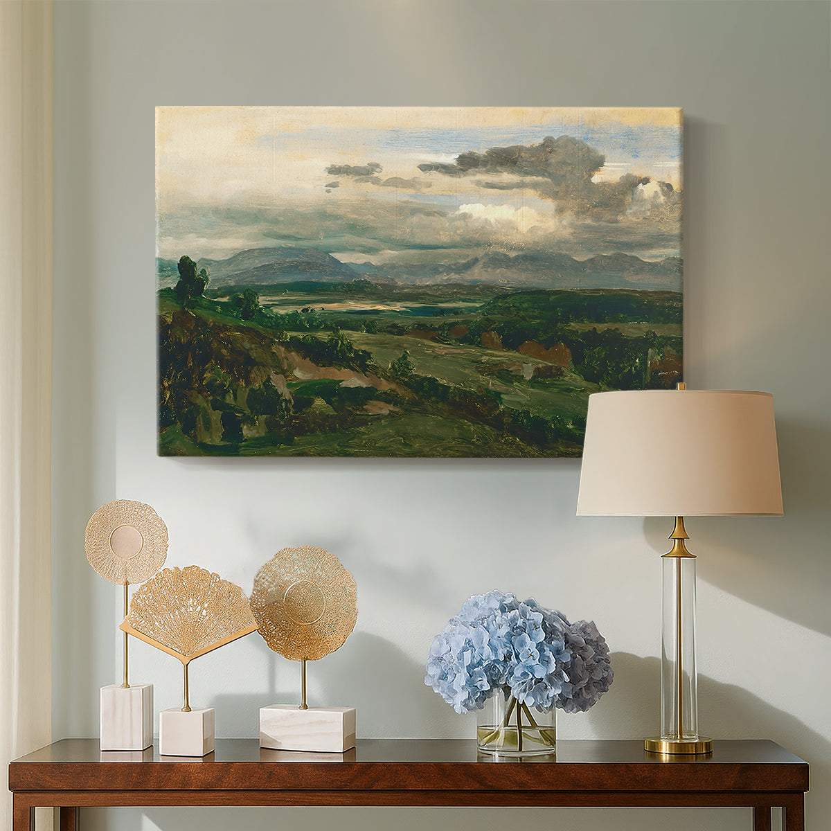 Canvas art print featuring an atmospheric landscape with architecture and elevation, displayed above a styled console table