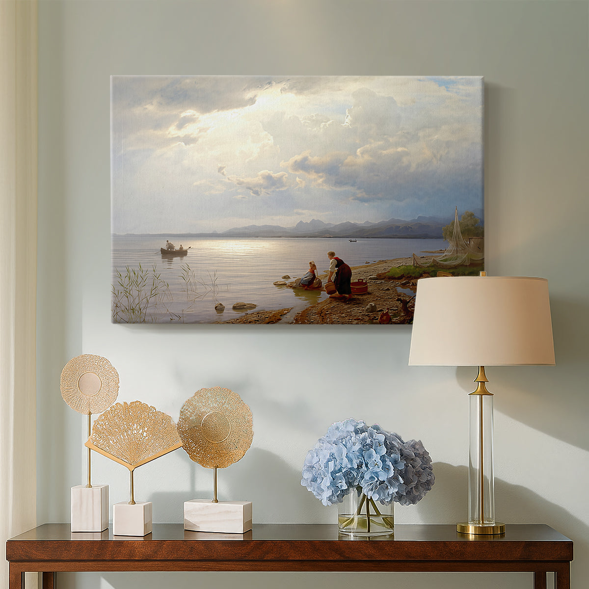 Canvas art print featuring an expansive composition combining figures and open water, displayed above a styled console table