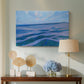 Canvas art print featuring flattened landscape forms, displayed above a styled console table