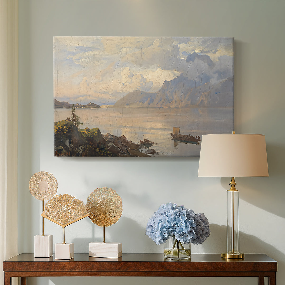 Canvas art print featuring an alpine lake landscape with reflections and open sky, displayed above a styled console table