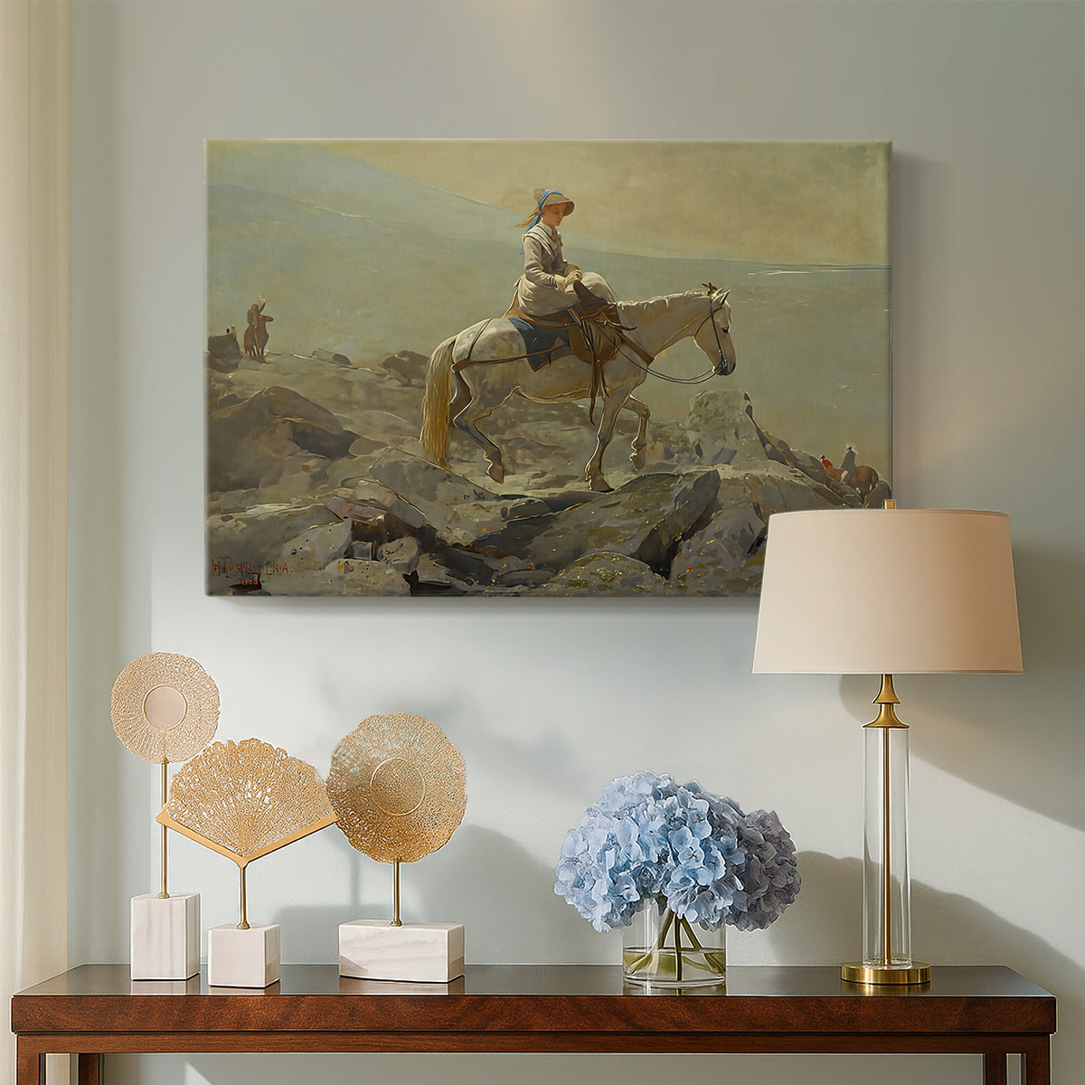 Canvas art print featuring a mountainous composition with person and horse in open terrain, displayed above a styled console table