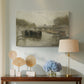 Canvas art print featuring a quiet riverside view with a bridge and subdued tones, displayed above a styled console table