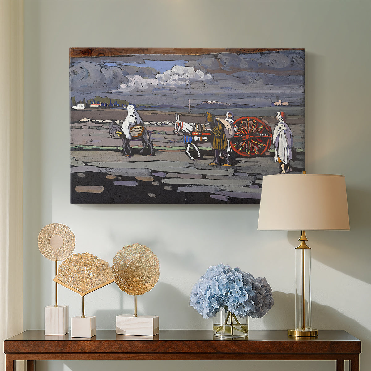 Canvas art print featuring an expressive composition combining road, figures, and terrain, displayed above a styled console table