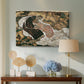 Canvas art print featuring an expressionist painting of human figures in dramatic pose, displayed above a styled console table