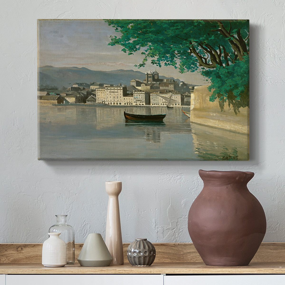 Canvas art print featuring a soft atmospheric view of city beside water, styled above a decorative console