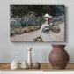 Canvas art print featuring a figure resting in colorful garden under soft light, styled above a decorative console