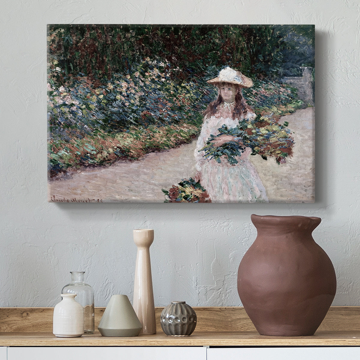 Canvas art print featuring a figure resting in colorful garden under soft light, styled above a decorative console