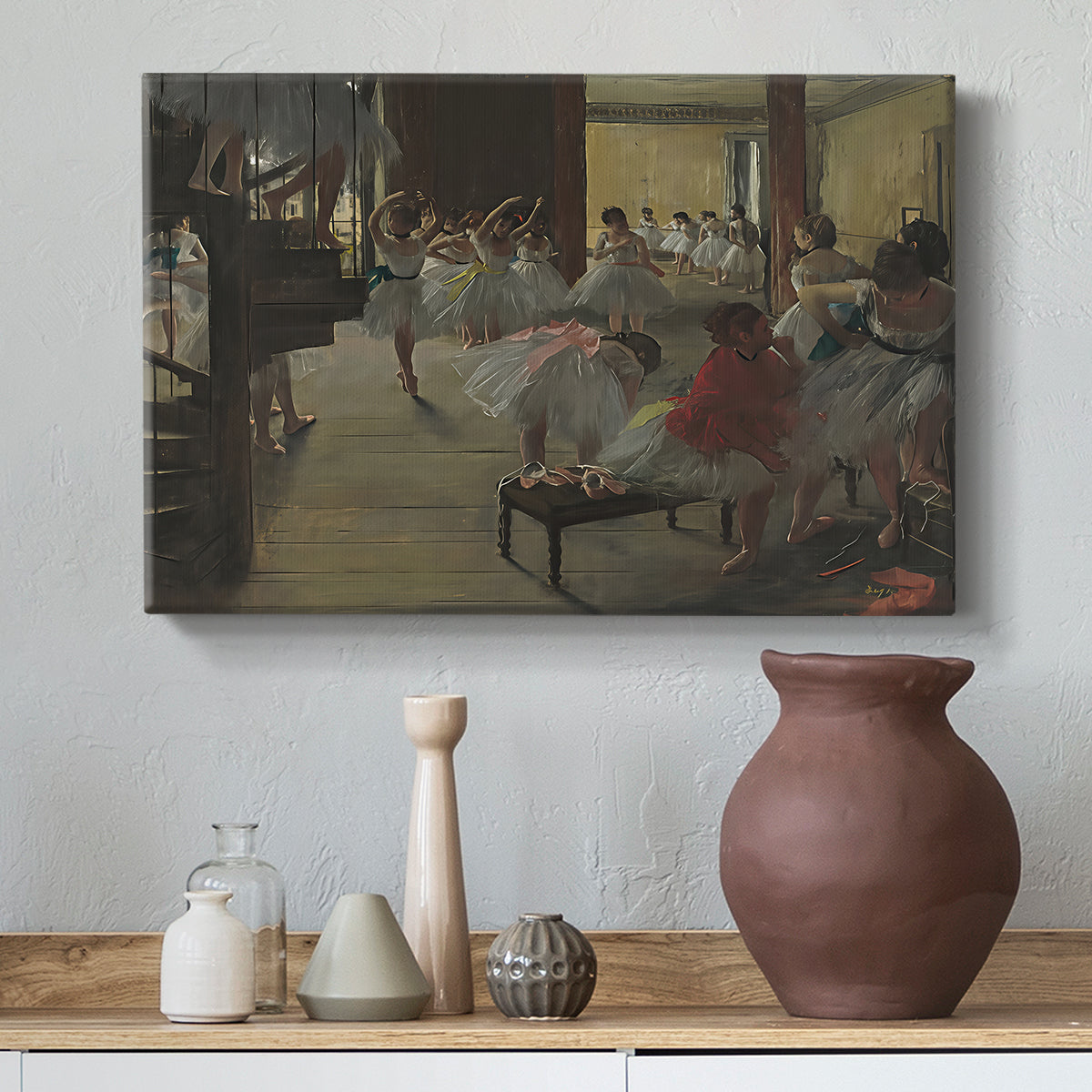 Canvas art print featuring an impressionist studio interior filled with ballet students, styled above a decorative console
