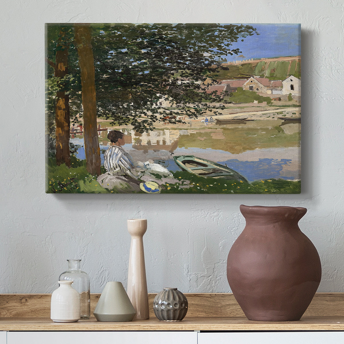 Canvas art print featuring an impressionist landscape with people relaxing along the Seine, styled above a decorative console