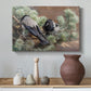 Canvas art print featuring a realistic scene of crows interacting on grassy terrain, styled above a decorative console