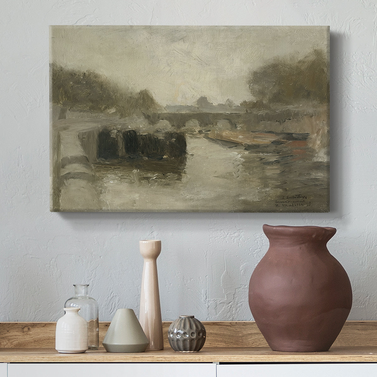 Canvas art print featuring a quiet riverside view with a bridge and subdued tones, styled above a decorative console