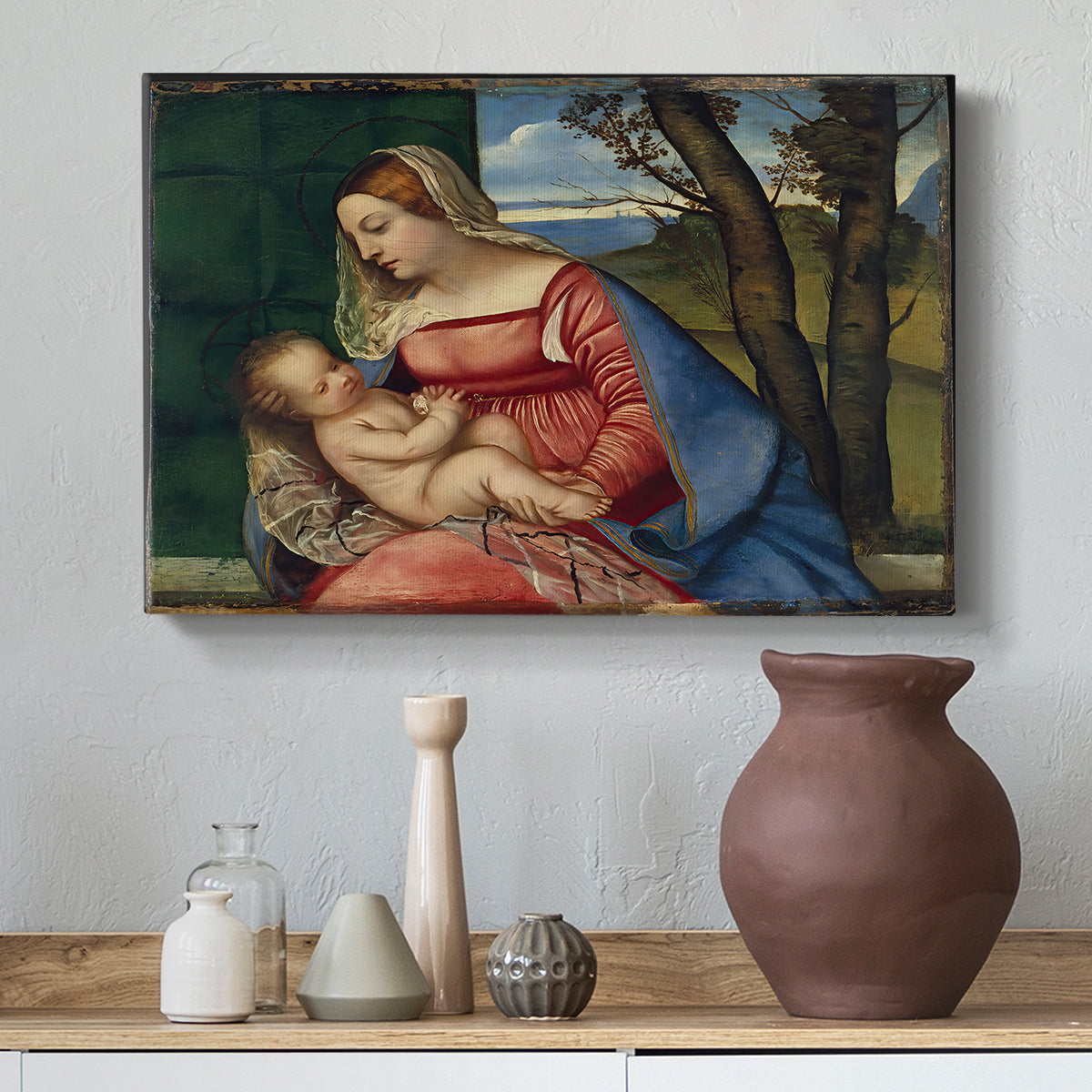 Canvas art print featuring a Renaissance composition focused on Madonna and child in seated pose, styled above a decorative console